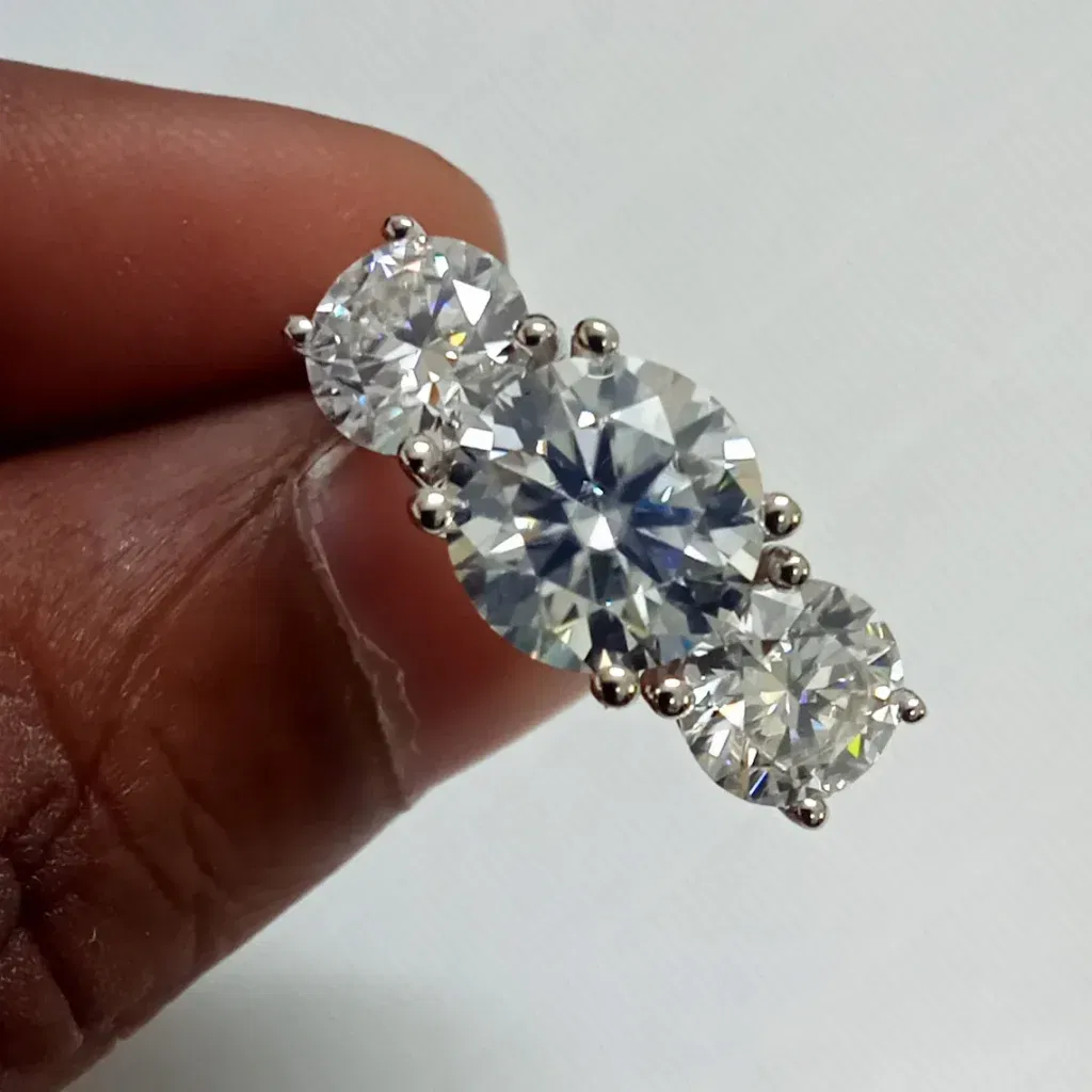 Classic Round Moissanite Three-Stone Ring .jpg