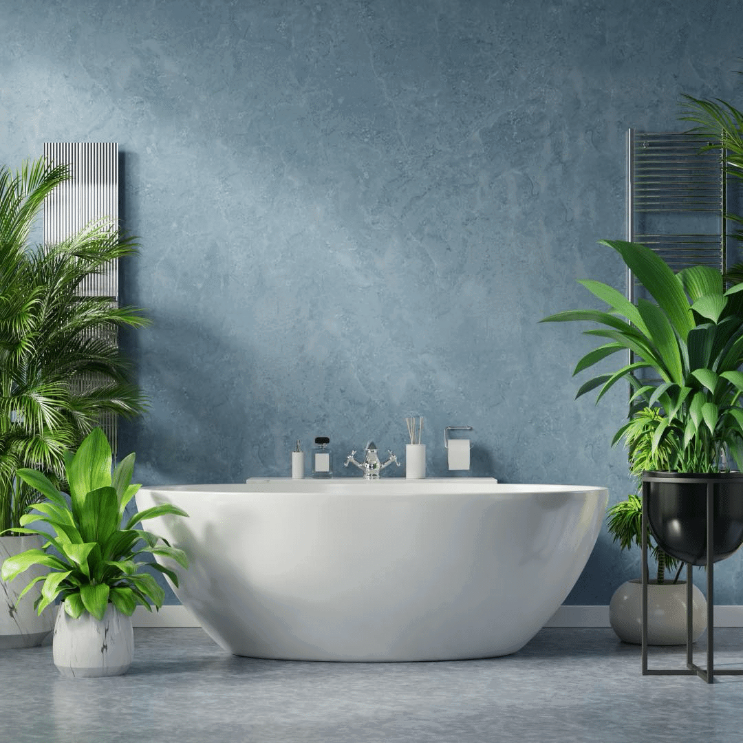 A bathroom with a tub and potted plants Description automatically generated