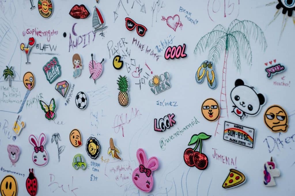 a wall covered in lots of different types of stickers