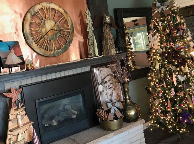 A fireplace with a christmas tree and a clock

AI-generated content may be incorrect.